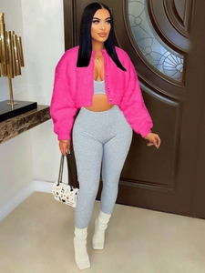 Women's fuzzy hot pink faux fur short jacket paired with grey ribbed knit two-piece set
