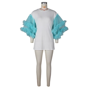 Detail of white t-shirt dress featuring layered light blue mesh ruffle sleeves
