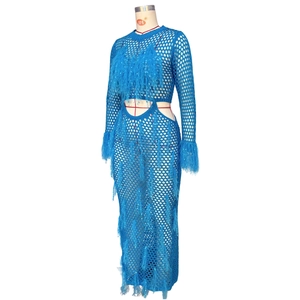 Detail of bright blue crochet mesh set featuring sequin tassels and intricate fringe trim