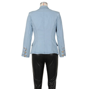 Detail of slim-fit denim blazer back with gold buttons on sleeves and seam stitching