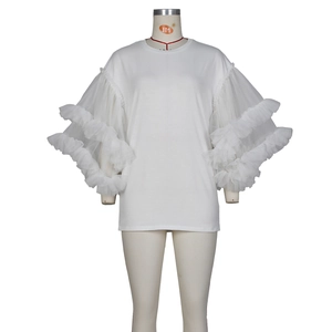 Detail of multi-layered mesh puff sleeves on a white round neck cotton T-shirt dress