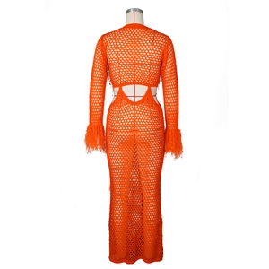Detail of orange crochet mesh dress with faux fur trim and hollow out back design