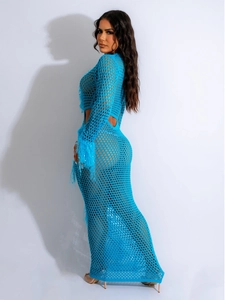 Detail of electric blue crochet maxi dress featuring cut-out waist and feather cuffs