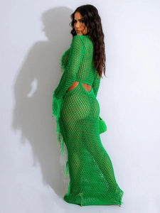 Detail view of neon green crochet beach dress featuring fringe and镂空openwork knit pattern