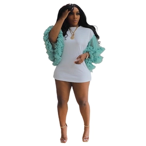 Detail of white T-shirt dress featuring multi-layered mint green mesh tiered sleeves