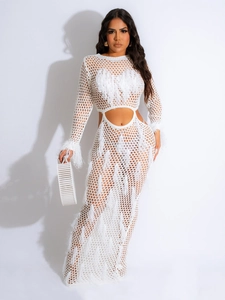 White crochet knit maxi dress with fringe details and hollow out design on white background