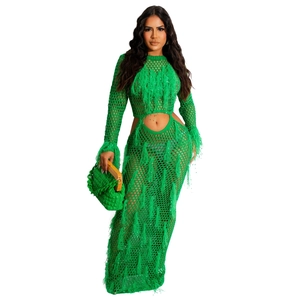 Detail of green crochet dress with diamond mesh knit and long fringe tassels