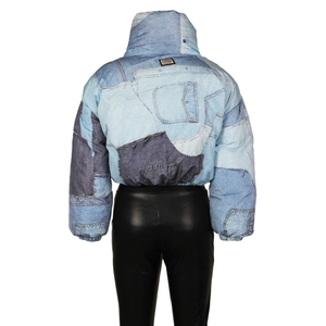 Detailed back view of short patchwork denim print puffer jacket with high collar design