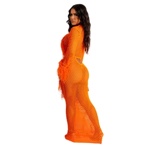 Close-up of bright orange crochet knit mesh texture and fluffy feather fringe sleeves