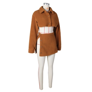 Close-up of brown faux shearling two-piece set featuring cropped jacket and slit mini skirt