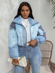 Women's cropped puffer jacket featuring stylish denim patchwork design and high stand collar