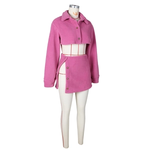 Detail of pink fleece two-piece set featuring cropped button-up top and side-button mini skirt