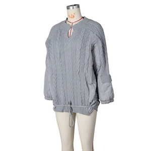 Detailed cable knit pattern and quilted patchwork texture on this casual grey winter jacket