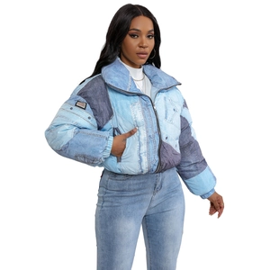 Detail of blue denim patchwork puffer jacket with stand collar and zipper closure