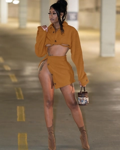 Detail of ginger yellow faux lamb wool two-piece set featuring cropped shirt and split skirt