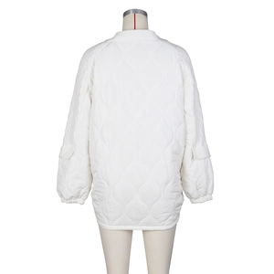 Back view of a white quilted puffer jacket with ribbed collar and utility sleeve pockets
