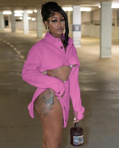 Hot pink faux shearling two-piece set featuring cropped jacket and high-slit mini skirt