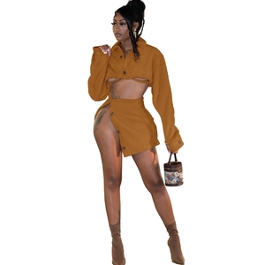 Close-up of brown faux shearling two-piece set with cropped jacket and high-slit mini skirt