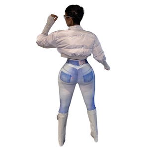 Rear view of silver short puffer jacket with blue denim print leggings and white boots