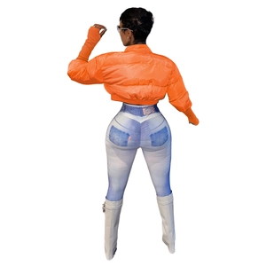 Detail view of orange quilted puffer jacket back with high waist slim fit printed trousers