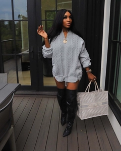 Detail of grey cable knit oversized hoodie with adjustable drawstring and zipper collar