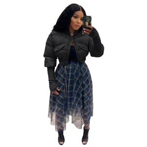 Detail view of black cropped puffer jacket with ribbed cuffs and stand collar
