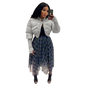 Detail of light grey puffer jacket with stand collar and plaid tulle patchwork skirt