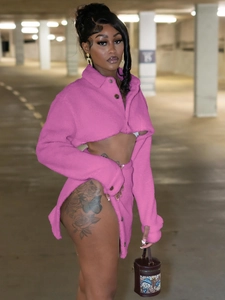 Hot pink fuzzy two-piece set with long sleeve crop top and side slit mini skirt