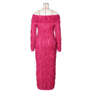 Detail of rose red off-shoulder maxi dress with vertical 3D ruffle texture and long sleeves