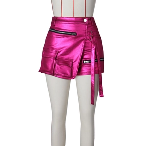 Detailed view of hot pink metallic cargo skirt with black zipper and functional pockets