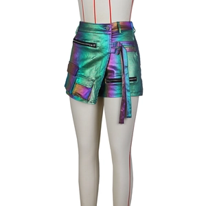 Detail of metallic laser fabric cargo shorts with iridescent purple and green gradient