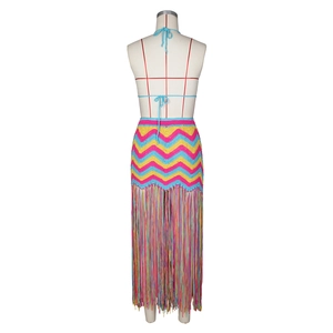 Detail view of colorful crochet two-piece set with zigzag pattern and long fringes