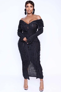 Detail of black off-shoulder maxi dress featuring ruffled layers and button-up front design