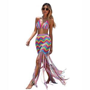 Detail of crochet beach set featuring bohemian wave pattern and long colorful fringes