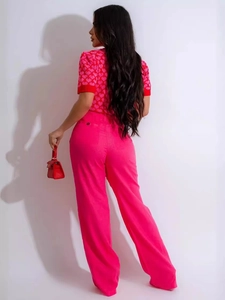Back view of pink heart pattern knit top paired with high waist magenta wide leg trousers