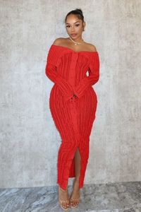 Detail of red off-shoulder maxi dress with vertical wavy texture and front button closure