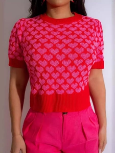 Women's red short sleeve knit top with pink heart patterns and crew neck design