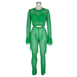 Detail of green knit two-piece set with mesh hollow-out texture and feather fringes