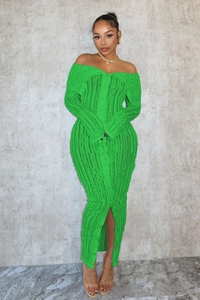 Detail of neon green off-shoulder knit dress featuring ribbed texture and front buttons