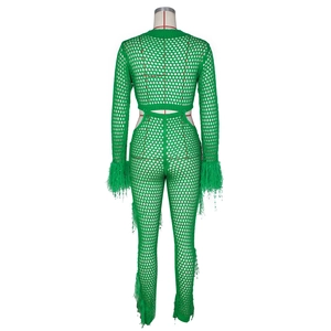 Detail of green knit hollow bodysuit featuring elegant feather accents on the sleeves