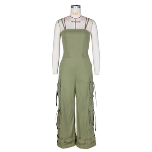 Detail view of army green strapless jumpsuit with utility cargo pockets and wide leg cut