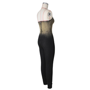 Detail view of the back metal zipper and brown to black gradient on denim jumpsuit