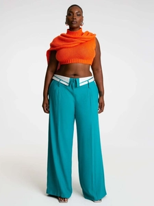 Set donna con top in maglia arancione e pantaloni blu a gamba larga con bordo bianco