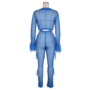Close-up of blue crochet knit pattern and soft feather trim details on the sleeve cuff
