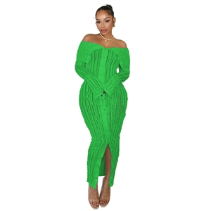 Close-up of green off-shoulder knit dress with vertical ribbing and button details