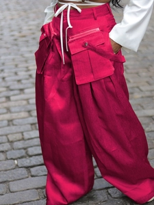 Fuchsia wide-leg cargo pants with oversized pockets and drawstring waist for street fashion