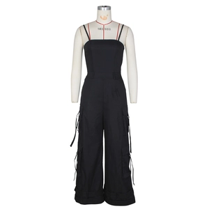 Detail of high-waisted black strapless cargo jumpsuit with large side pockets and drawstring