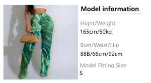 Detail of high waist straight pants with green marble print and side fringe accents