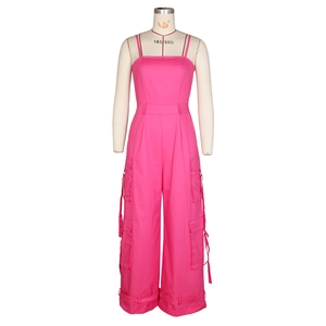 Detailed view of rose red cargo jumpsuit with large functional pockets and drawstrings
