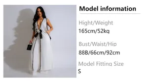 Detailed size guide with model measurements for women's bow camellia jumpsuit set